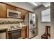 Efficient kitchen layout featuring stainless steel appliances and plenty of cabinet space at 2309 Withers Dr. # 5, Myrtle Beach, SC 29577
