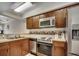 Well-appointed kitchen featuring wood cabinetry, stainless steel appliances and tile flooring at 2309 Withers Dr. # 5, Myrtle Beach, SC 29577