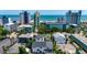 Aerial view of homes surrounded by Myrtle Beach hotels and the ocean at 2309 Withers Dr. # 7, Myrtle Beach, SC 29577