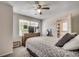 Bright bedroom featuring a ceiling fan, large window and dresser at 2309 Withers Dr. # 7, Myrtle Beach, SC 29577