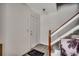 Light and bright entry with gray wood floors, stairs to the right, and a palm tree print at 2309 Withers Dr. # 7, Myrtle Beach, SC 29577