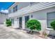 The exterior of the building is white with two doorways and bushes on the side at 2309 Withers Dr. # 7, Myrtle Beach, SC 29577
