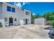 View of the home's bright, white exterior with a well-maintained lot, a storage shed, and a private entrance at 2309 Withers Dr. # 7, Myrtle Beach, SC 29577