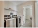 Laundry room featuring side-by-side stainless steel washer and dryer and shelving at 2309 Withers Dr. # 7, Myrtle Beach, SC 29577