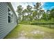 Property featuring an expansive backyard with lush green grass and a black fence at 2315 Blackthorn Dr., Conway, SC 29526