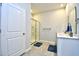 Bathroom with double sink vanity, shower, and blue rugs is modern and functional at 2315 Blackthorn Dr., Conway, SC 29526