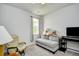 Bedroom featuring neutral walls, a window with curtains, and a couch with teddy bears at 2315 Blackthorn Dr., Conway, SC 29526