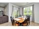 Sunlit dining room with a wooden table and black chairs creates a cozy space at 2315 Blackthorn Dr., Conway, SC 29526