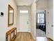 Entryway featuring wood flooring, a console table, and a view into the bedroom at 2315 Blackthorn Dr., Conway, SC 29526