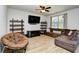 Cozy living room with comfortable seating, modern shelving, and natural light at 2315 Blackthorn Dr., Conway, SC 29526