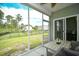 Inviting screened porch with views of the fenced backyard and surrounding trees at 2315 Blackthorn Dr., Conway, SC 29526