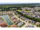 Aerial view of a peaceful neighborhood showcasing homes with well-kept lawns, a pond, and mature trees at 2318 Via Palma Dr., North Myrtle Beach, SC 29582