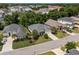 Aerial view showcasing a well-manicured property with lush landscaping and a spacious driveway in a residential area at 2318 Via Palma Dr., North Myrtle Beach, SC 29582