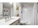 Bright bathroom featuring a shower with curtain, and a sink with stylish mirror and fixtures at 2318 Via Palma Dr., North Myrtle Beach, SC 29582