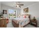 Bright bedroom featuring stylish decor, a comfortable bed, and a picturesque view from the window at 2318 Via Palma Dr., North Myrtle Beach, SC 29582