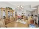 Bright and elegant dining space with stylish chandelier and easy access to the kitchen and the living room at 2318 Via Palma Dr., North Myrtle Beach, SC 29582
