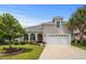Charming home with a well-manicured lawn, inviting entryway, and a spacious garage at 2318 Via Palma Dr., North Myrtle Beach, SC 29582