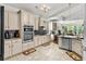 Efficient kitchen featuring tiled floors, modern appliances, and granite countertops provides convenience in cooking at 2318 Via Palma Dr., North Myrtle Beach, SC 29582