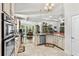 Modern kitchen with granite counters, stainless appliances and seamless access to the dining and living areas at 2318 Via Palma Dr., North Myrtle Beach, SC 29582