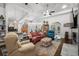 Bright living room with hardwood floors, ceiling fans, open to kitchen and dining, great for entertaining guests at 2318 Via Palma Dr., North Myrtle Beach, SC 29582