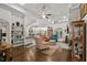 Open-concept living room with fireplace, hardwood floors, and neutral colors provide a cozy and inviting atmosphere at 2318 Via Palma Dr., North Myrtle Beach, SC 29582