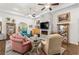 Well-lit living room with fireplace and hardwood floors offers an ideal space for relaxation and social gatherings at 2318 Via Palma Dr., North Myrtle Beach, SC 29582