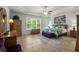 Spacious bedroom boasts tray ceilings, a ceiling fan, a window view, and stylish furnishings at 2318 Via Palma Dr., North Myrtle Beach, SC 29582