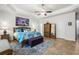 Well-appointed main bedroom offers a comfortable bed, ceiling fan, accent art, and natural light from the window at 2318 Via Palma Dr., North Myrtle Beach, SC 29582
