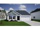 Charming one-story home with a well-manicured lawn and attached garage at 245 Nw Mayflower Dr., Calabash, NC 28467