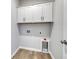 Convenient laundry room with ample cabinet space and modern hardware at 245 Nw Mayflower Dr., Calabash, NC 28467