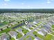 A scenic aerial view shows a beautiful home nestled in a tranquil community with picturesque pond views at 2572 Brescia St., Myrtle Beach, SC 29579