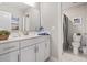 Bright bathroom featuring a marble countertop vanity, a toilet room, and neutral decor at 2572 Brescia St., Myrtle Beach, SC 29579