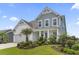 Beautiful home with a two-car garage, blue accents and lush landscaping at 2572 Brescia St., Myrtle Beach, SC 29579