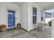 Cozy front porch with a blue door and sitting area, perfect for relaxing at 2572 Brescia St., Myrtle Beach, SC 29579