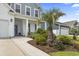 Inviting walkway to a lovely home with vibrant plants and a two-car garage at 2572 Brescia St., Myrtle Beach, SC 29579