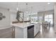 Large kitchen island offers seating and ample counter space, seamlessly connecting to dining area at 2572 Brescia St., Myrtle Beach, SC 29579
