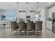 Open kitchen design with white cabinetry, stainless appliances, and a breakfast bar for casual dining at 2572 Brescia St., Myrtle Beach, SC 29579