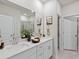 Bright bathroom with double sinks, quartz countertops, and a glass-enclosed shower at 2606 Tranquility Loop, Longs, SC 29568