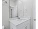 Bright bathroom features a white vanity with granite countertop and modern fixtures at 2610 Tranquility Loop, Longs, SC 29568