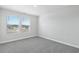 Bright bedroom with neutral carpet and natural light, features a view of the neighborhood at 2610 Tranquility Loop, Longs, SC 29568