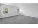 Spacious bedroom with carpet and dual windows at 2610 Tranquility Loop, Longs, SC 29568