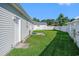 Manicured backyard with a well-maintained lawn and white privacy fence at 264 La Patos Dr., Myrtle Beach, SC 29588