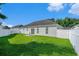 Large backyard with a pristine lawn and a white picket fence at 264 La Patos Dr., Myrtle Beach, SC 29588