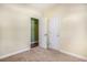 Neutral-toned bedroom featuring carpet, with view to living area through white double doors, and a white door at 264 La Patos Dr., Myrtle Beach, SC 29588
