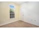 Neutral bedroom with a window providing natural light and a standard closet at 264 La Patos Dr., Myrtle Beach, SC 29588