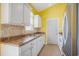 Functional kitchen featuring white cabinets, tiled backsplash, and stainless steel appliances at 264 La Patos Dr., Myrtle Beach, SC 29588