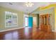Spacious living room boasts hardwood floors, large windows, and a vibrant blue door at 264 La Patos Dr., Myrtle Beach, SC 29588