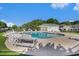 Community pool with lounge chairs and picnic table, surrounded by greenery at 264 La Patos Dr., Myrtle Beach, SC 29588
