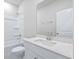 Clean, bright bathroom with quartz countertop vanity, shower-tub combo, and white finishes at 2700 Tranquility Loop, Longs, SC 29568
