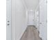 Bright hallway with wood-look flooring and white trim at 2700 Tranquility Loop, Longs, SC 29568